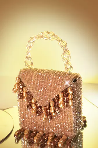 Semi velvet  suede based gold handbag with crystal bead work
