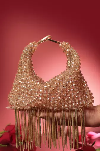 Gold potli bag with crystal work