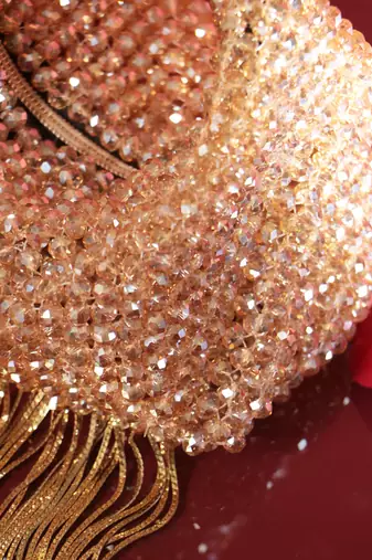 Gold potli bag with crystal work