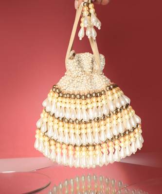 Beige semi suede pearl embroidered potli bag 1