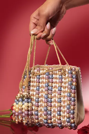 Multicolour suede based handbag adorned with intricate beadwork pearls