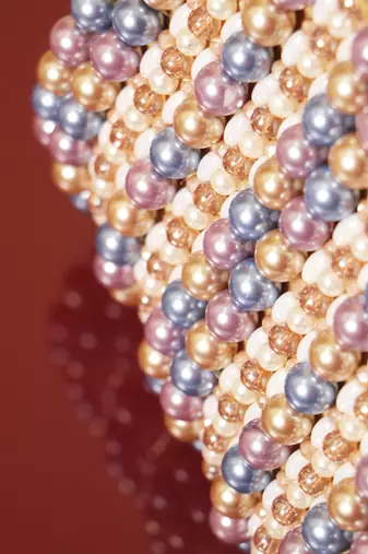 Multicolour suede based handbag adorned with intricate beadwork pearls