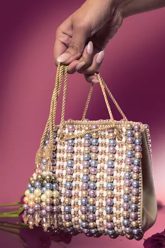 Multicolour suede based handbag adorned with intricate beadwork pearls
