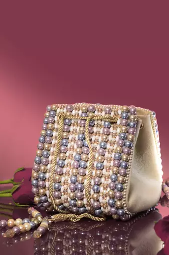 Multicolour suede based handbag adorned with intricate beadwork pearls