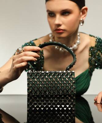 Green handfcrafted semi suede mini rivet bag 1