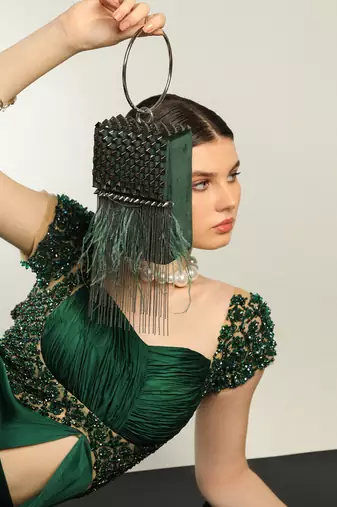 Green semi suede handbag with a gun metal chain
