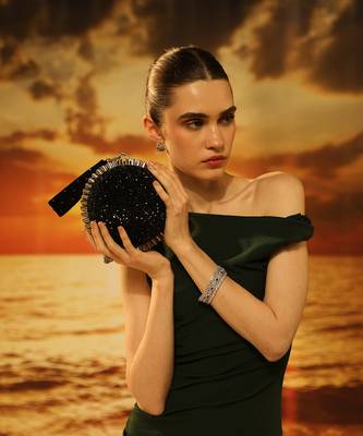 Black semi suede crystal embellished hand bag 1