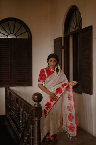 Cotton white embroidered red border cotton saree