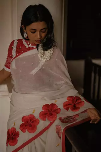 Cotton white embroidered red border cotton saree