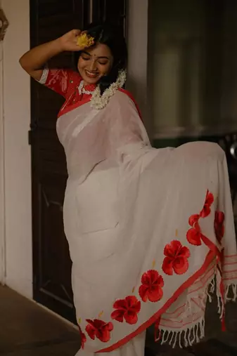 Cotton white embroidered red border cotton saree