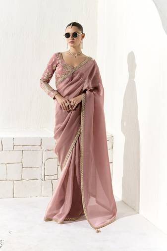 Peach glass tissue saree with sequin zari weaving blouse