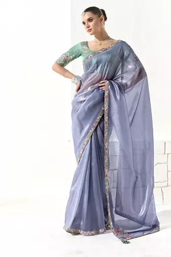 Light blue glass tissue saree with sequin zari weaving blouse