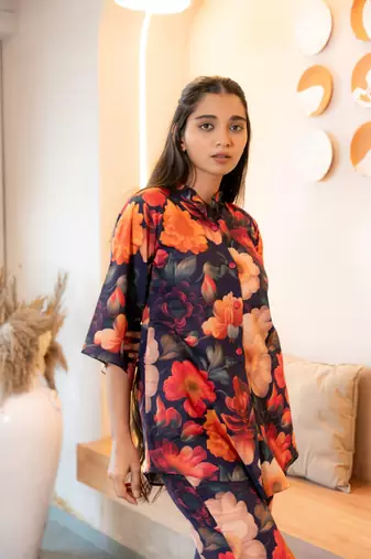 Half buttoned bold floral flared printed cotton top