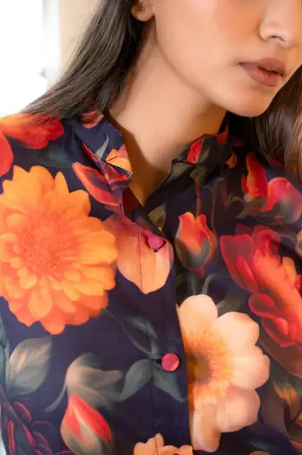 Half buttoned bold floral flared printed cotton top