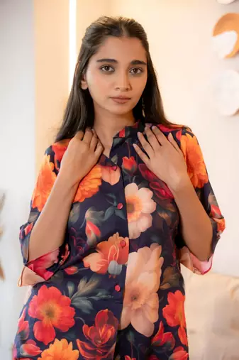 Half buttoned bold floral flared printed cotton top
