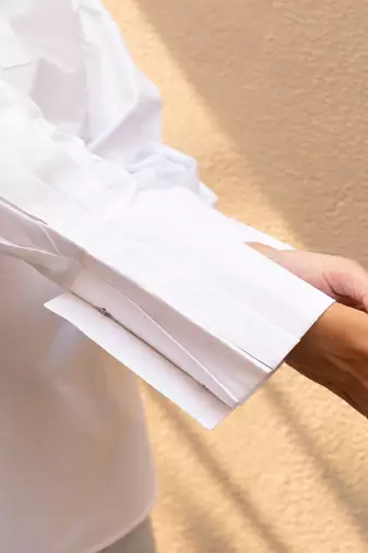 White cotton solid knife pleated collar top
