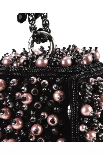 Black suede handbag adorned with pearls