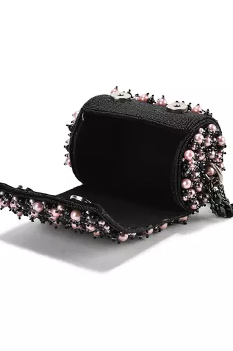 Black suede handbag adorned with pearls