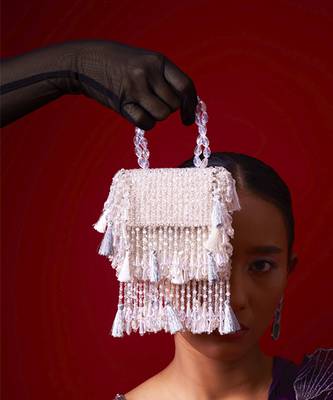 White suede embroidered handbag with flowy detailing 3