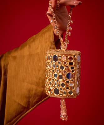 Gold satin potli bag adorned with mirror detailing 1