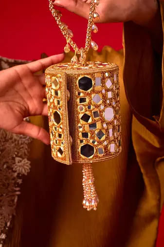 Gold satin potli bag adorned with mirror detailing