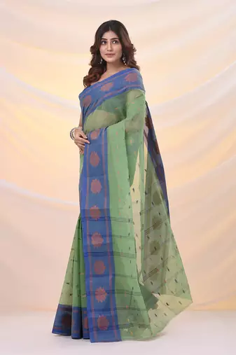 Green pure cotton tant saree with woven designs
