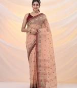 Beige pure cotton tant saree with woven designs