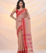 Beige pure cotton tant saree with woven designs