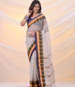 White pure cotton tant saree with woven designs