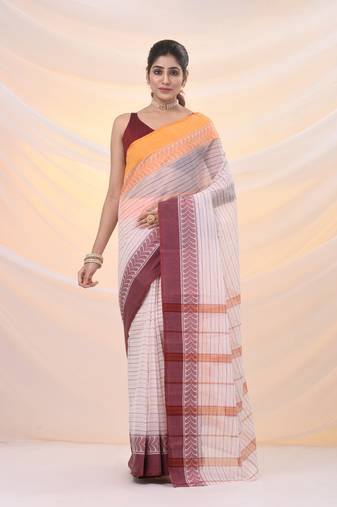 White pure cotton tant saree with woven designs