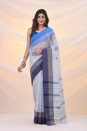 White pure cotton tant saree with woven designs