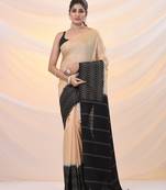 Beige silk blend saree with weaved borders