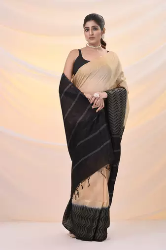 Beige silk blend saree with weaved borders