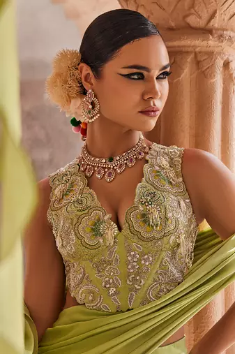 Green satin plain saree with embroidered blouse