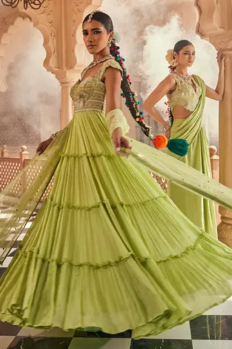 Green satin plain saree with embroidered blouse