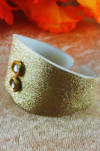 Golden acrylic kundan stud free size bracelets