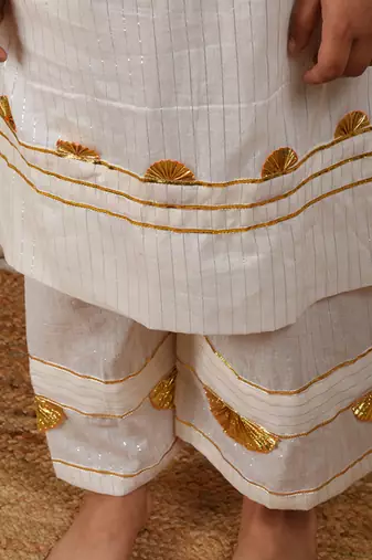 Ivory cotton woven kurta paired with palazzo