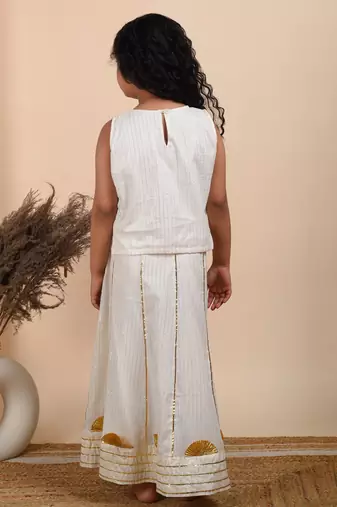 Ivory cotton woven top paired with skirt