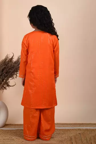 Orange cotton woven kurta paired with palazzo