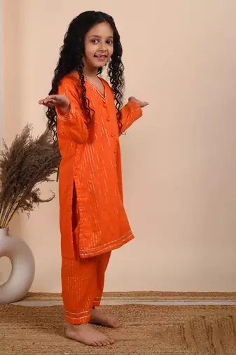 Orange cotton woven kurta paired with palazzo