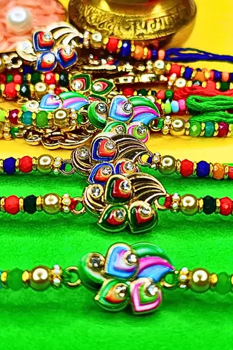 combo of 12 beaded cotton thread with ad stones & meenakari designer rakhi for brother
