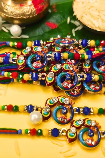 combo of 12 beaded cotton thread with ad stones & meenakari designer rakhi for brother