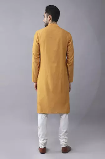 Mustard silk printed kurta jacket paired with kurta & pant