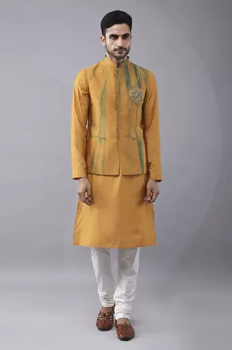 Mustard silk printed kurta jacket paired with kurta & pant