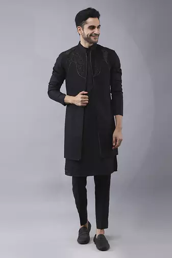 Black solid silk jacket paired with kurta & pant