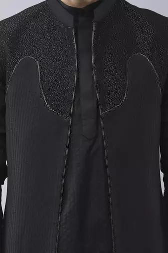 Black solid silk jacket paired with kurta & pant