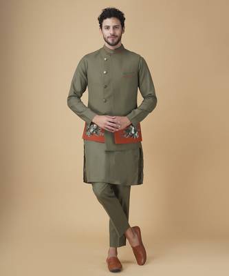 Emerald solid silk bandhgala jacket paired with kurta & pant 1