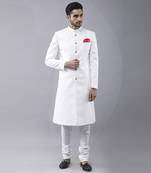 White brocade solid sherwani paired with kurta & churidaar