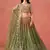 Delightful gradient from warm beige to deep mehndi green sequins zari embroidered georgette indian lehenga