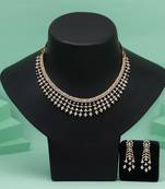 White color american diamond necklace set featuring intricate polished detailing